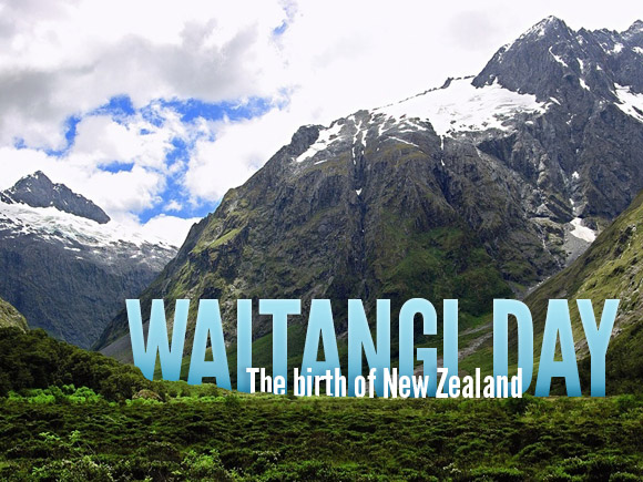 Landscape of New Zealand with large text emerging from the mountains